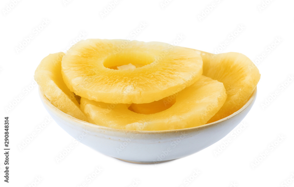 Bowl with slices of delicious sweet canned pineapple on white background Bowl with slices of delicious sweet canned pineapple on white background