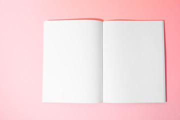 Empty book pages on pink background, top view. Mockup for design
