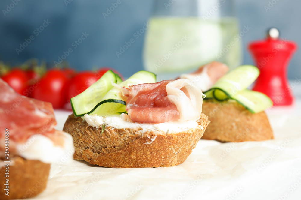 Tasty bruschettas with prosciutto served on table Tasty bruschettas with prosciutto served on table