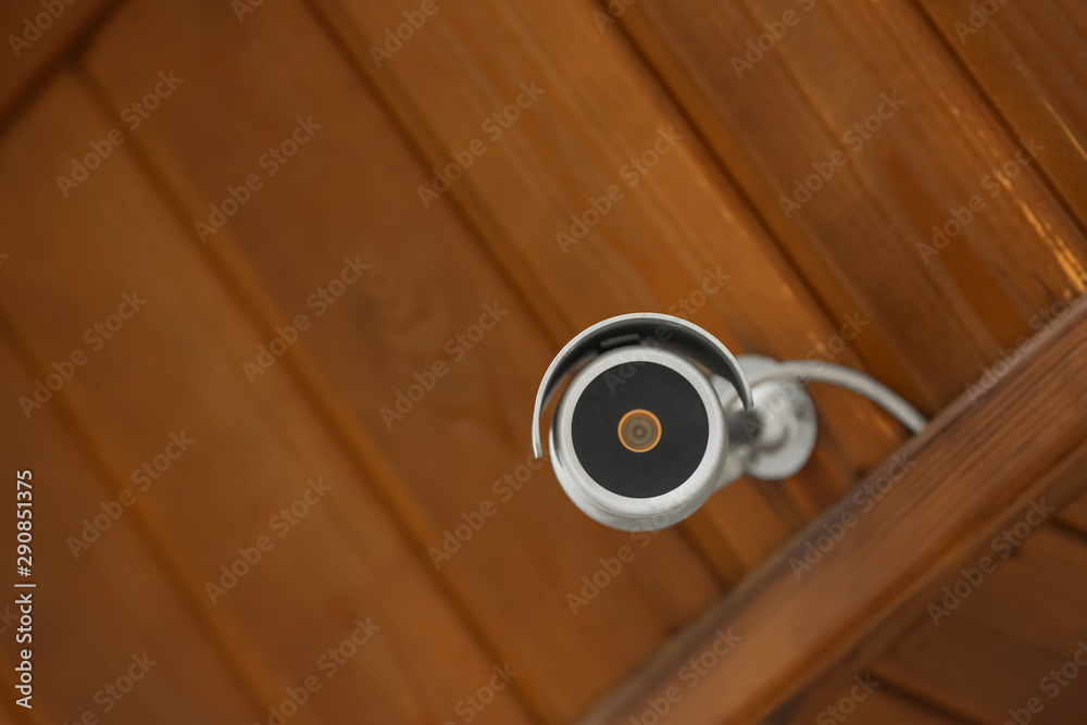 Modern CCTV security camera on building outdoors. Space for text Modern CCTV security camera on building outdoors. Space for text