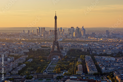Eiffel Tower, Les Invalides and business district of Defense at orange sunset, as seen from Montparnasse Tower, Paris, France
