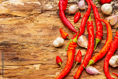 Red and orange chili pepper with garlic cooking food background
