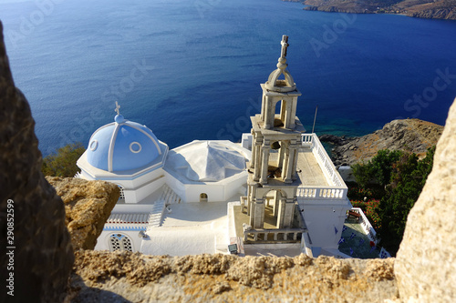 Picturesque church of Panagia Portaitisa as seen from iconic castle of Astypalaia island with views to the Aegean blue sea, Dodecanese, Greece photo