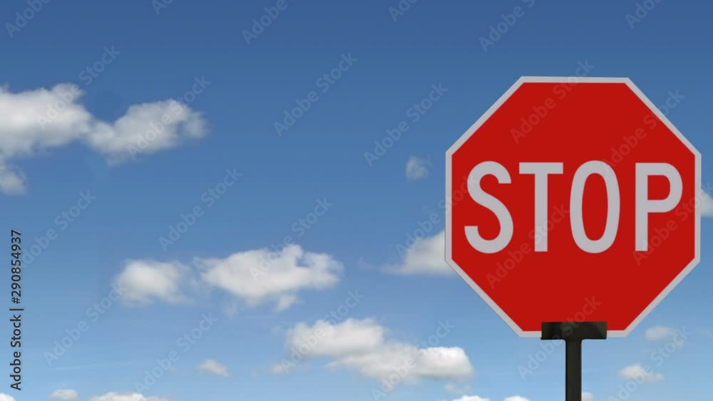 Driving to a stop sign on blue sky background.mov Driving to a stop sign on blue sky background.mov