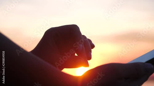 Young woman using apps on a mobile touchscreen smartphone. photo