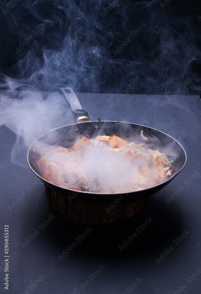 Fried meat in a frying pan closeup. Top view with copy space Fried meat in a frying pan closeup. Top view with copy space