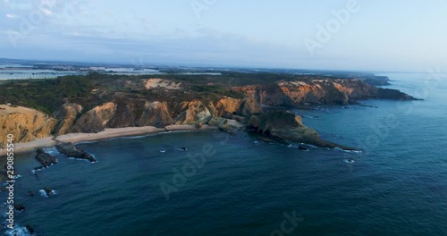 Aerial view of the beautiful Alteirinhos Beach at Zambujeira do Mar, Alentejo, at sunset. photo