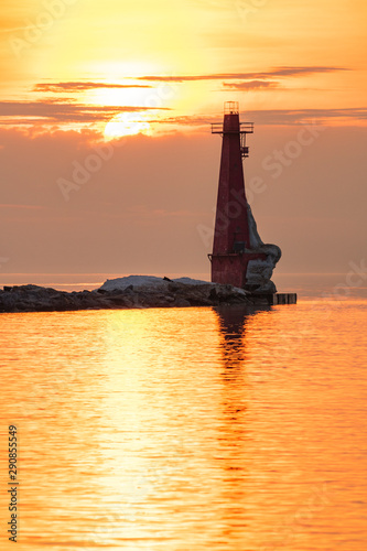 lighthouse at sunset in winter 