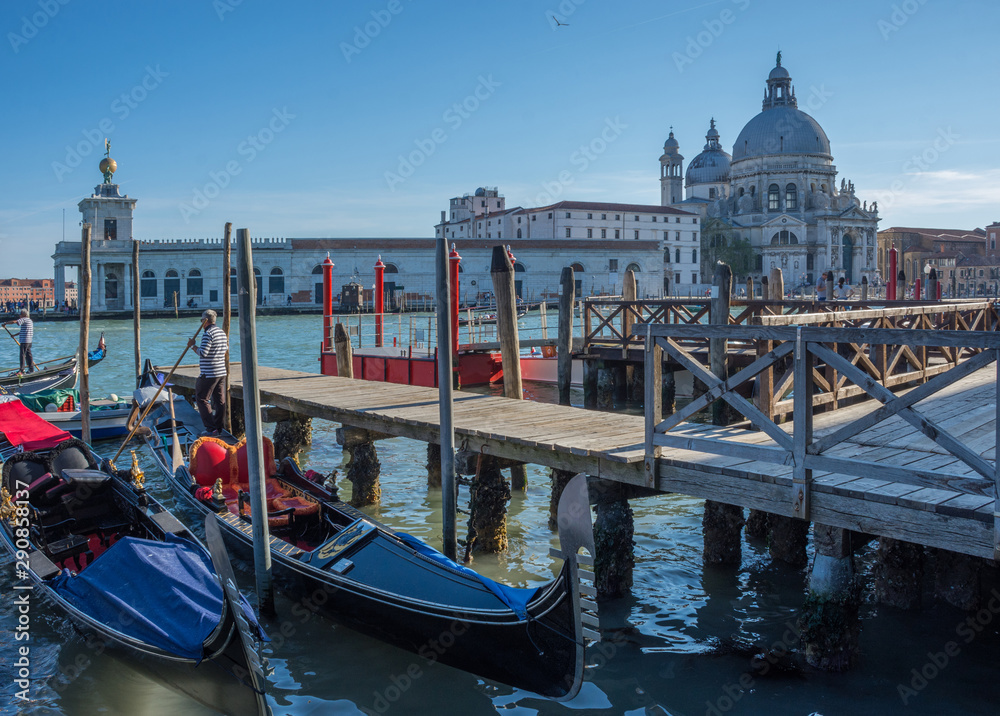 Gondolas on Canal Grande with Basilica di Santa Maria della Salute in the background in Venice, Italy