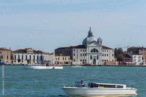 Boat on Canal Grande in front of Santa Maria della Presentazione church (Le Zitelle), in Venice, Italy. photo