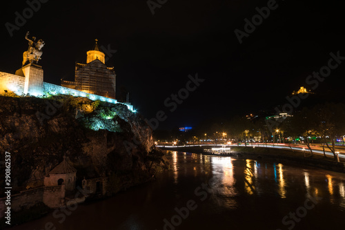 Night view of Kura embankment from Metekhi bridge in Tbilisi photo