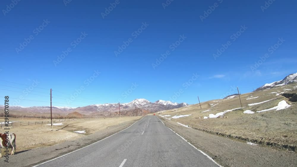 Driving along mountain asphalt road Chuysky Tract along Kurai Ridge on Altai betveen Kosh-Agach and Kurai intermountain hollows Driving along mountain asphalt road Chuysky Tract along Kurai Ridge on Altai betveen Kosh-Agach and Kurai intermountain hollows