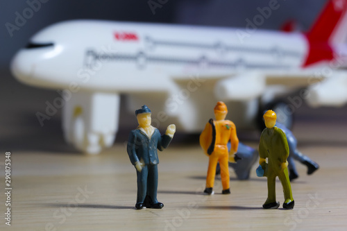 Airplane engineer, airport worker, aircraft people working in fixing, repairing the runway and checking the airplane. Many level of miniature company employee and employer figure as flight concept