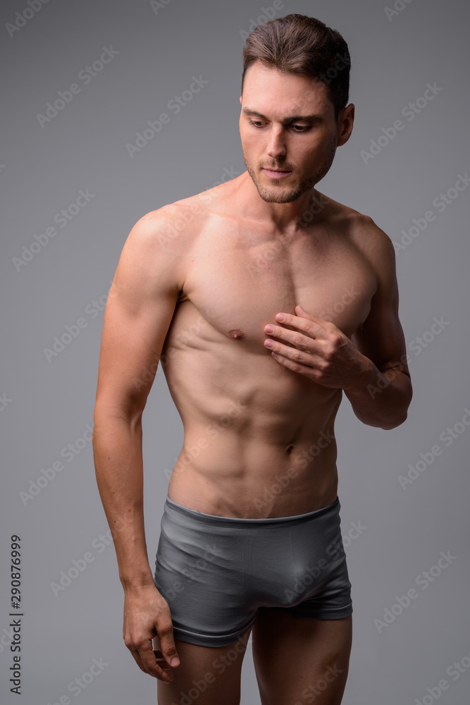 Studio shot of handsome muscular man shirtless