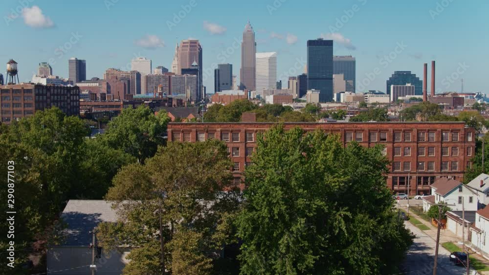 Rising drone shot from Cleveland Ohio's East side to reveal downtown skyline on a sunny Summer day Rising drone shot from Cleveland Ohio's East side to reveal downtown skyline on a sunny Summer day