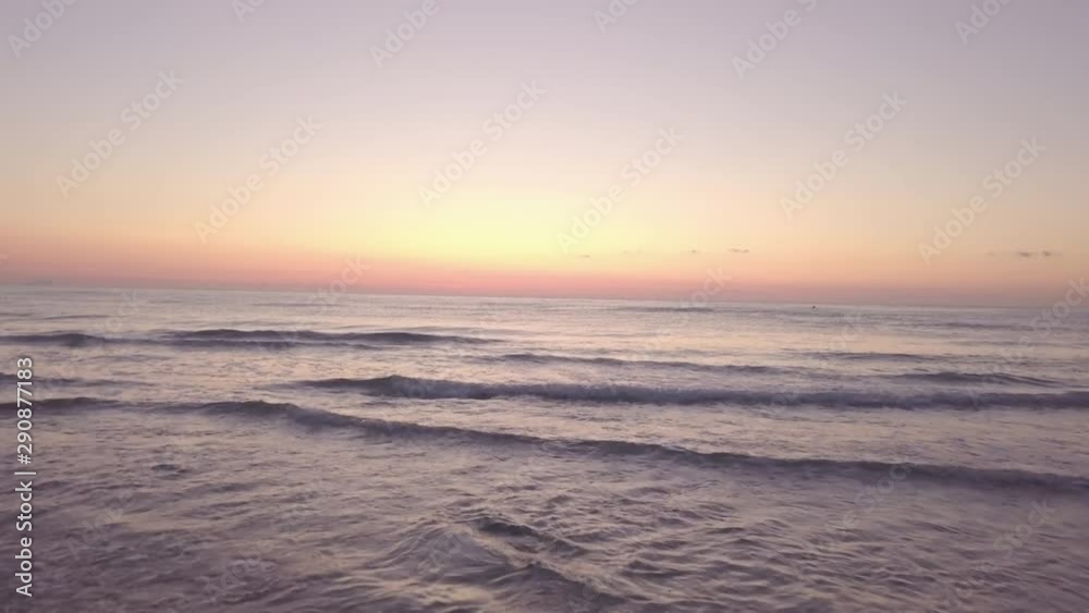 Rising aerial shot on a beach during sunrise. Rising aerial shot on a beach during sunrise.