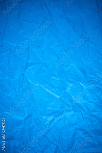 Blue paper crumpled recycle background.