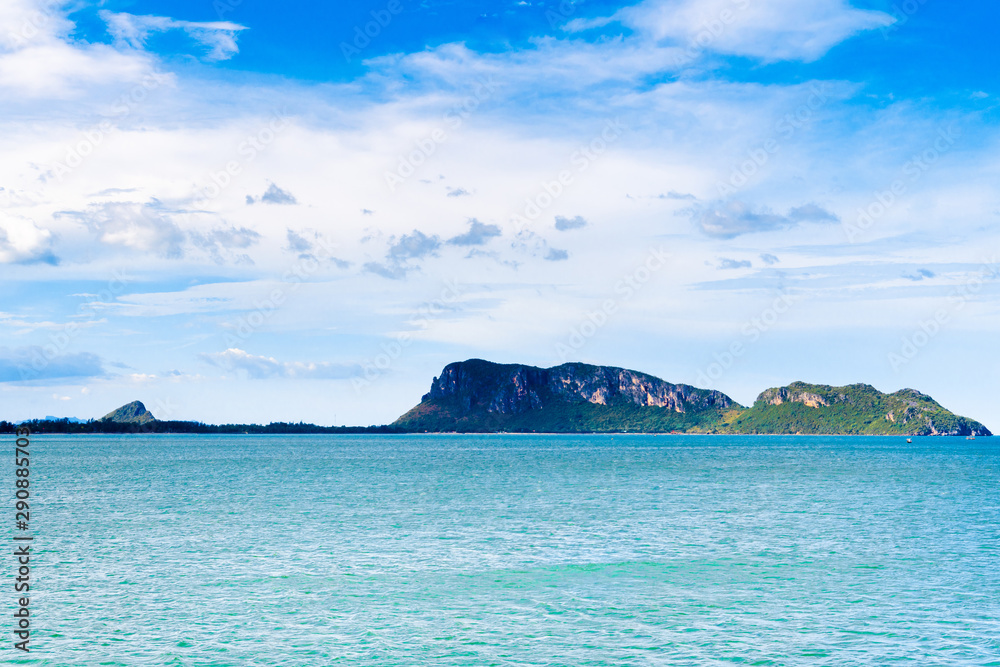 Ocean wave on tropical beach with golden sand and ripple of water splash from emerald blue-green sea water during summer vacation. Ocean wave on tropical beach with golden sand and ripple of water splash from emerald blue-green sea water during summer vacation.