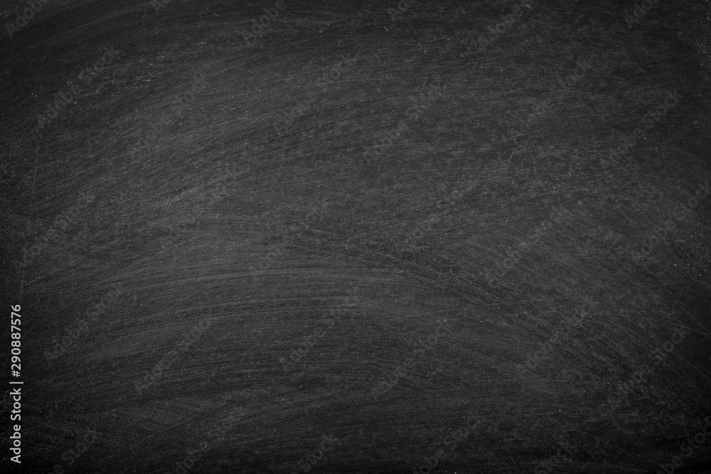 Fototapeta premium Working place on empty rubbed out on blackboard chalkboard texture background with colorful crayons chalk for classroom or wallpaper, add text message.