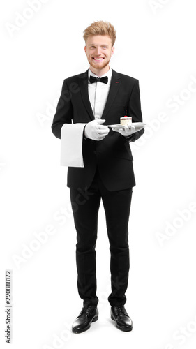 Handsome waiter with desser...
