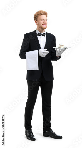 Handsome waiter with desser...