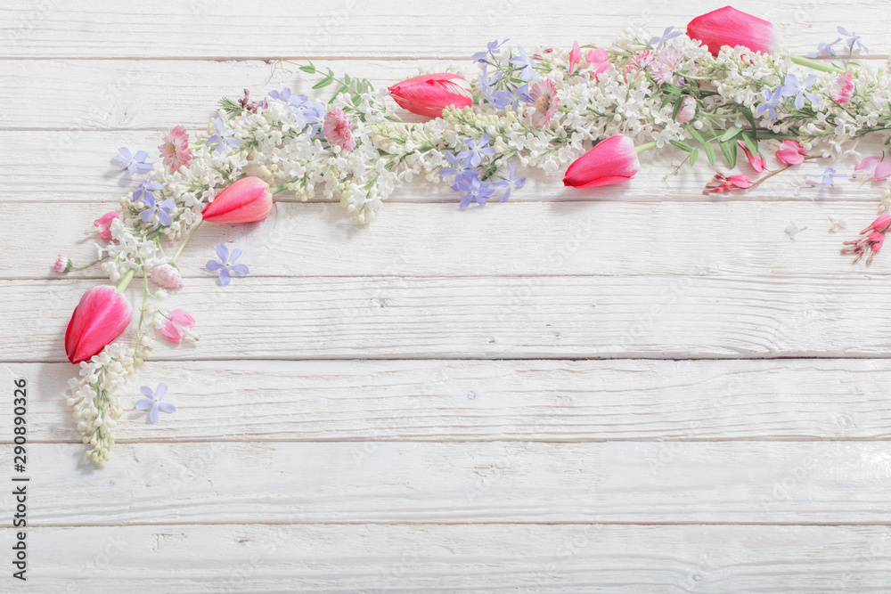 spring flowers on white wooden background