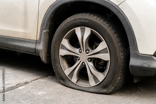 Wallpaper Mural Car Flat Tire. Tire leak on dirty car. Torontodigital.ca