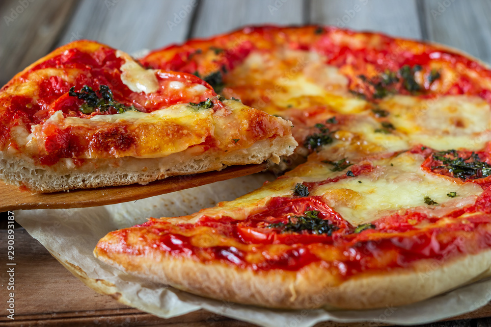 Italian pizza with tomatoes and mozzarella cheese. Italian cuisine. Margherita.