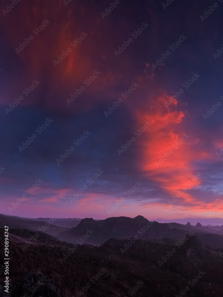 Mountain view morning of red clouds moving above top hills with blue sky background, twilight at Ban Ja Bo Hill Tribes Village, Pang Mapla, Mae Hong Son, northern of Thailand.