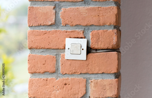 Lightswitch in a brick wall