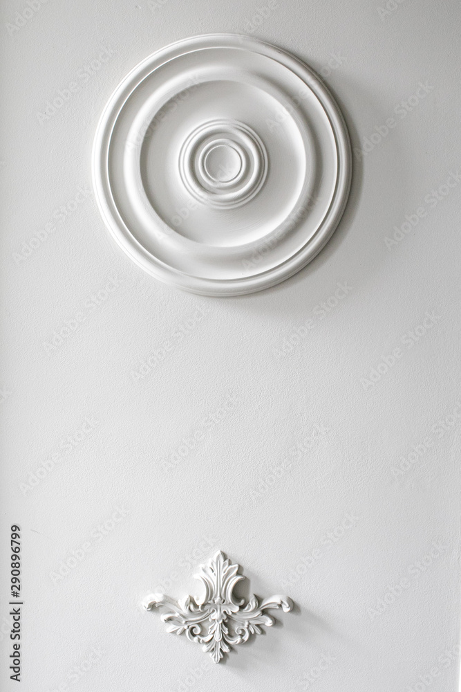 White wall molding with geometric shape and vanishing point. Luxury white wall design bas-relief with stucco mouldings roccoco element White wall molding with geometric shape and vanishing point. Luxury white wall design bas-relief with stucco mouldings roccoco element