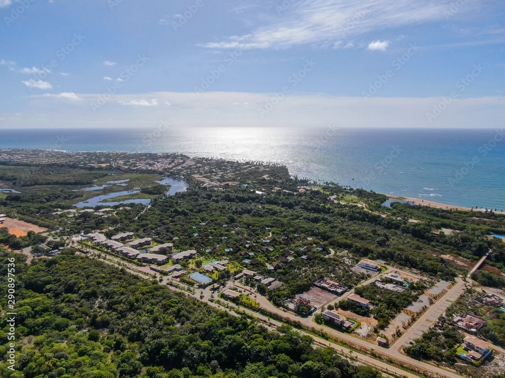 Aerial view of Praia Do Forte coastline town with blue ocean, Bahia, Brazil. Travel tropical destination.