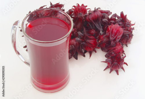 Hibiscus sabdariffa or roselle fruits  drink on white table photo