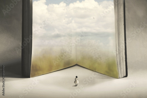 concept of imagination and freedom of a small woman who wants to enter a fantasy book photo
