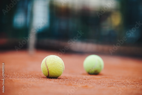 Close up of tennis balls on tennis court. Sport concept