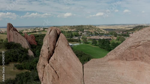 Arrowhead golf course resort in Littleton Colorado with green grass, red rocks, and blue skies photo