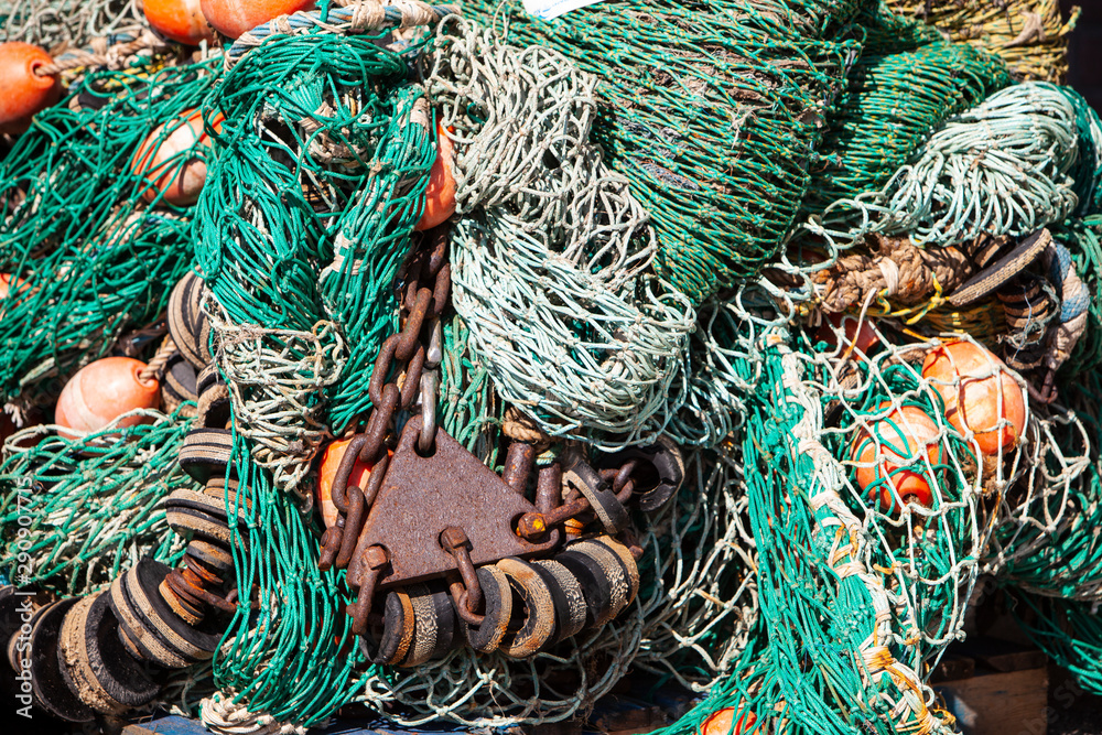 closeup of colorful fishing nets in harbor