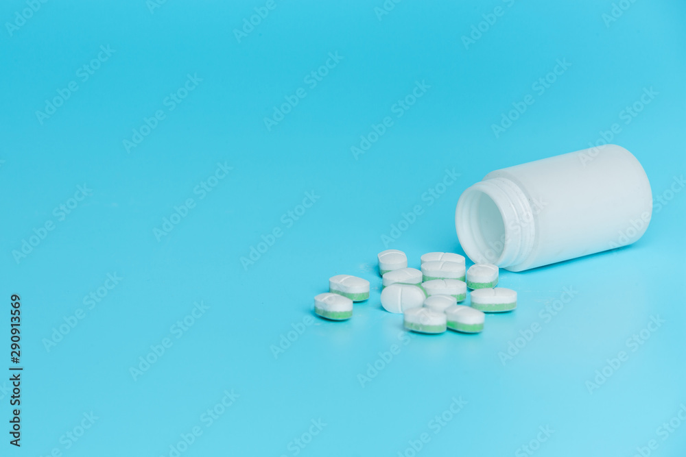 Concept of medicines, medical supplies placed on a blue background.