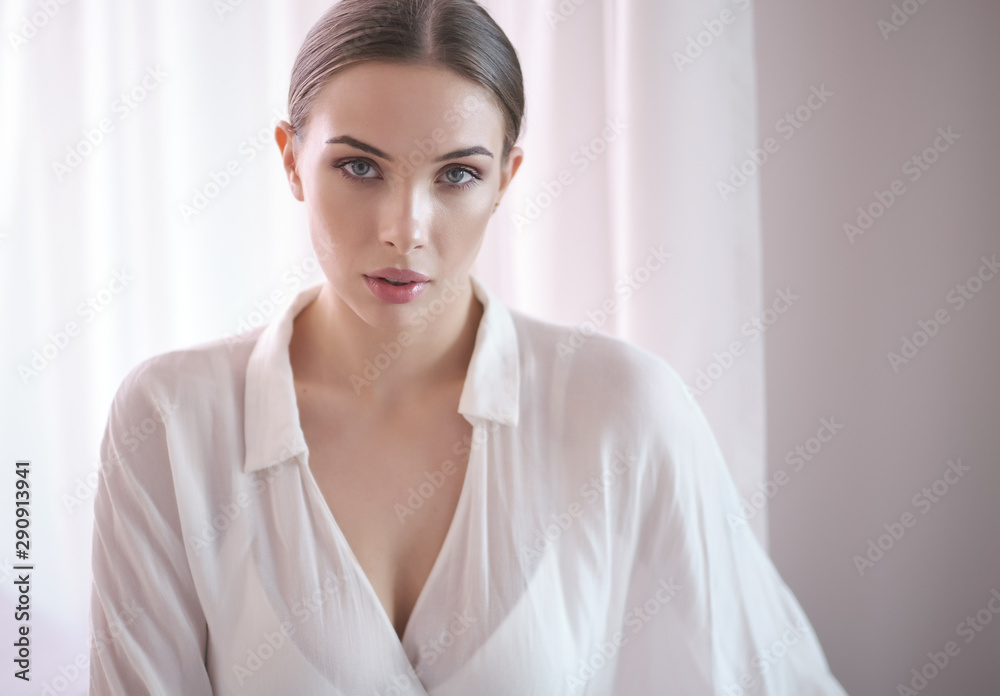 portrait of beautiful brunette woman looking at camera portrait of beautiful brunette woman looking at camera