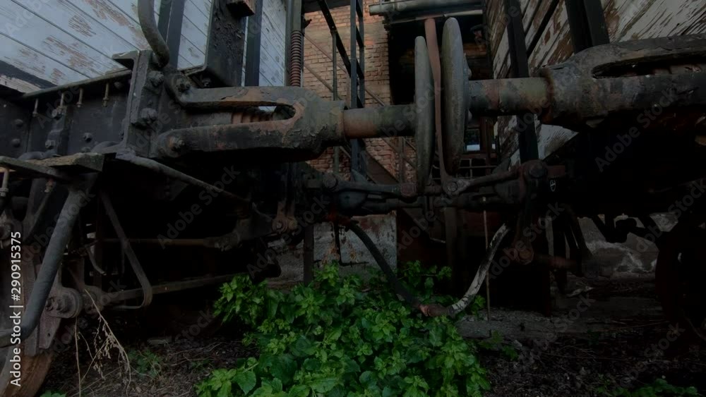 4K Low angle parallel moving under old abandoned railway wagon 4K Low angle parallel moving under old abandoned railway wagon