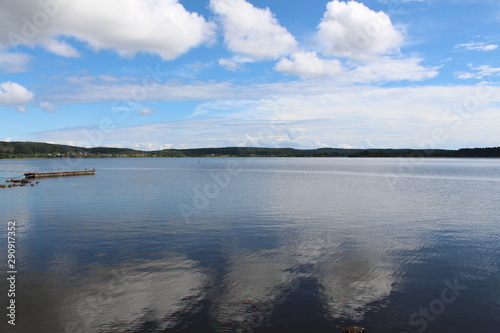 Calm and still lake during the summer in rural Russia