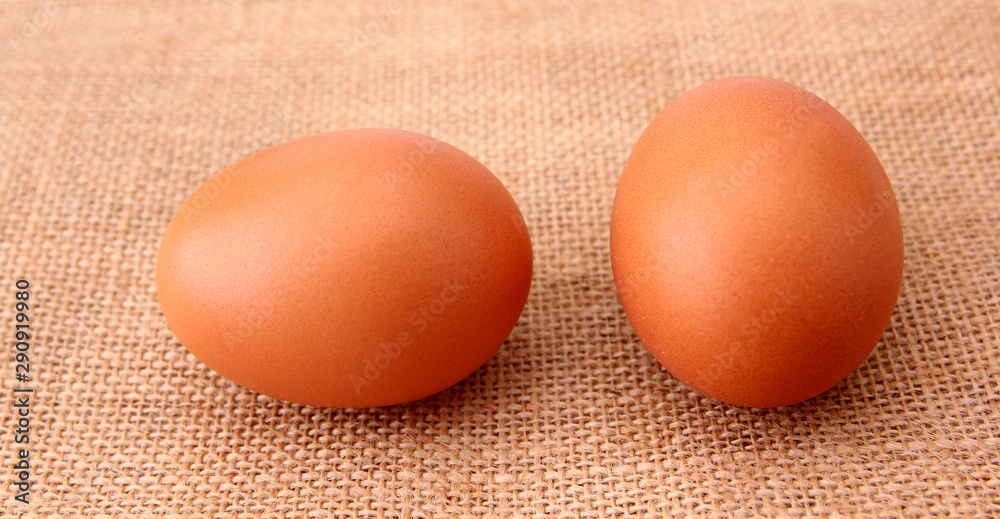 chicken Eggs isolated on the sackcloth backdrop. chicken Eggs isolated on the sackcloth backdrop.