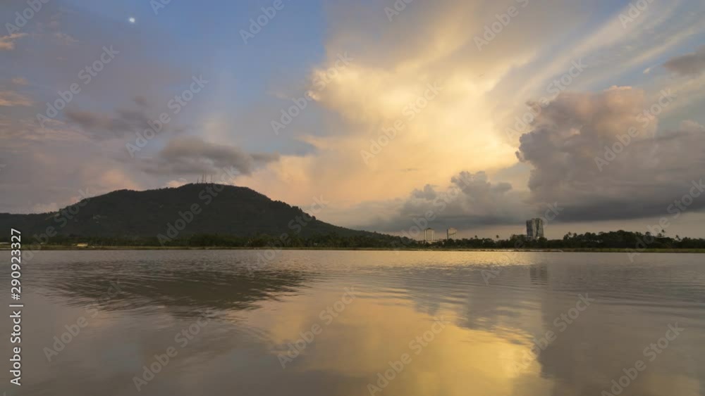 Timelapse reflection beautiful golden cloud formation. Hill and BM Plaza in the view at Bukit Mertajam hill. Timelapse reflection beautiful golden cloud formation. Hill and BM Plaza in the view at Bukit Mertajam hill.