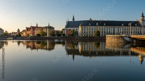 View of University of Wroclaw, Odra River and University Bridge in Wroclaw at sunrise. 