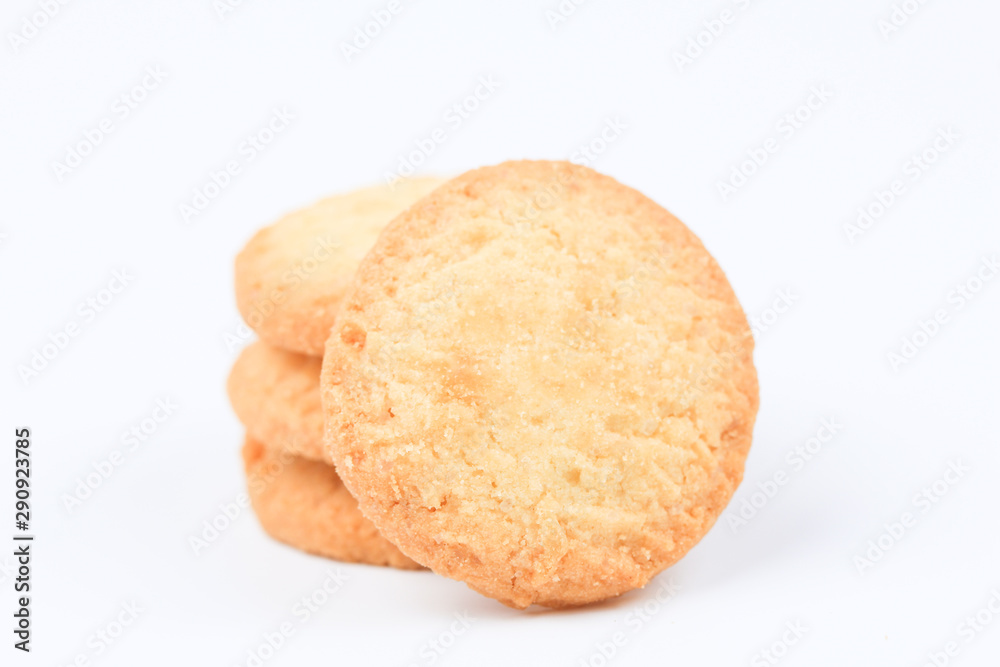 Round sweet cookies. Delicious dessert with high sugar and carbohydrate suitable for eating with milk and tea or coffee on color and white background with colorful placemat Round sweet cookies. Delicious dessert with high sugar and carbohydrate suitable for eating with milk and tea or coffee on color and white background with colorful placemat