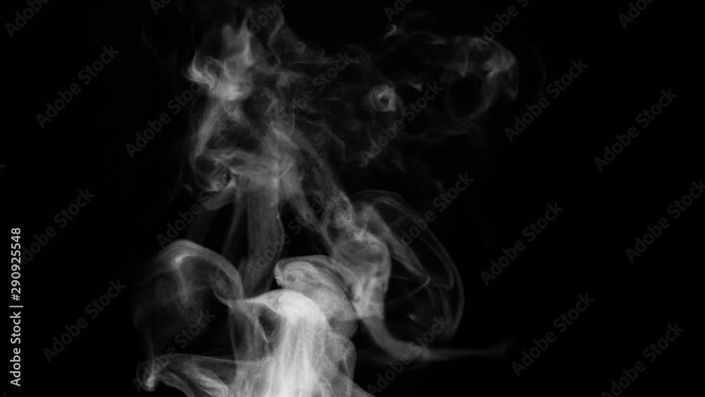 Rich Steam from a Cup of Tea. White steam rises light, graceful twists on a black background. The jet lifted out of the cup of hot water. Shooting at a rate of 120fps. Footage is perfect for the top Rich Steam from a Cup of Tea. White steam rises light, graceful twists on a black background. The jet lifted out of the cup of hot water. Shooting at a rate of 120fps. Footage is perfect for the top