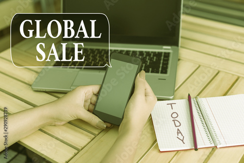 Word writing text Global Sale. Business photo showcasing analysisagers operations for companies do business internationally woman laptop computer smartphone office supplies technological devices