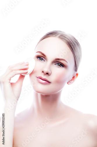 portrait of young woman with perfect skin apply cream cosmetics makup. Isolated. White background. Copy space