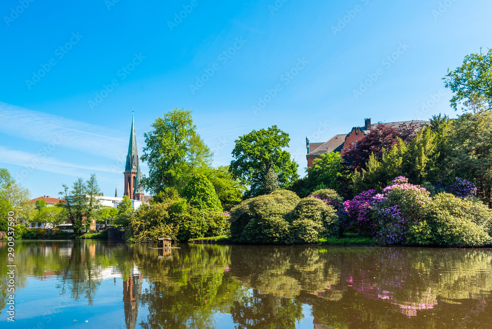 View of the pond and St. Lamberti Church of Oldenburg, Germany.
