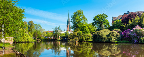 Photography View of the pond and St. Lamberti Church of Oldenburg, Germany.